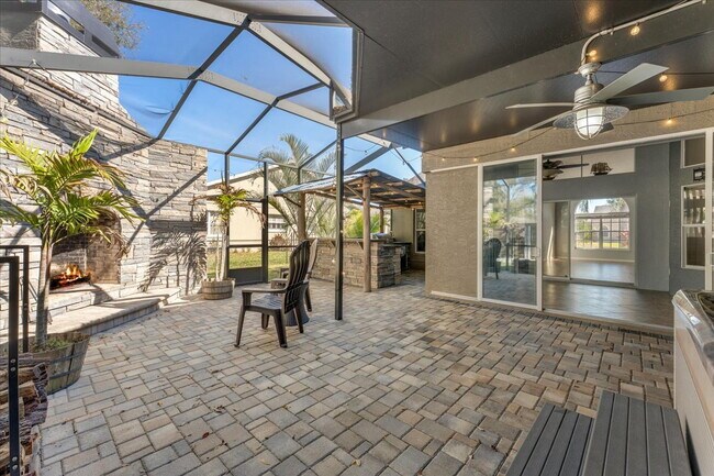 Building Photo - A vibrant 2-bedroom, 2-bathroom tropical retreat designed for both high-energy entertaining and l...