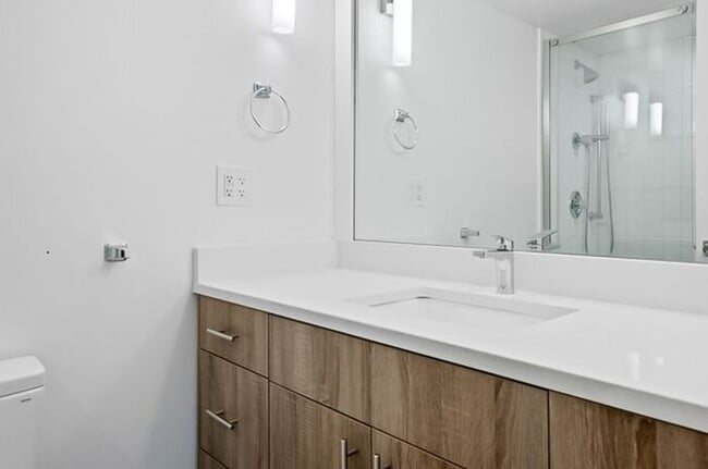 Building Photo - 2BR Condo w/ Covered Parking and Balcony Views at Broadway Towers