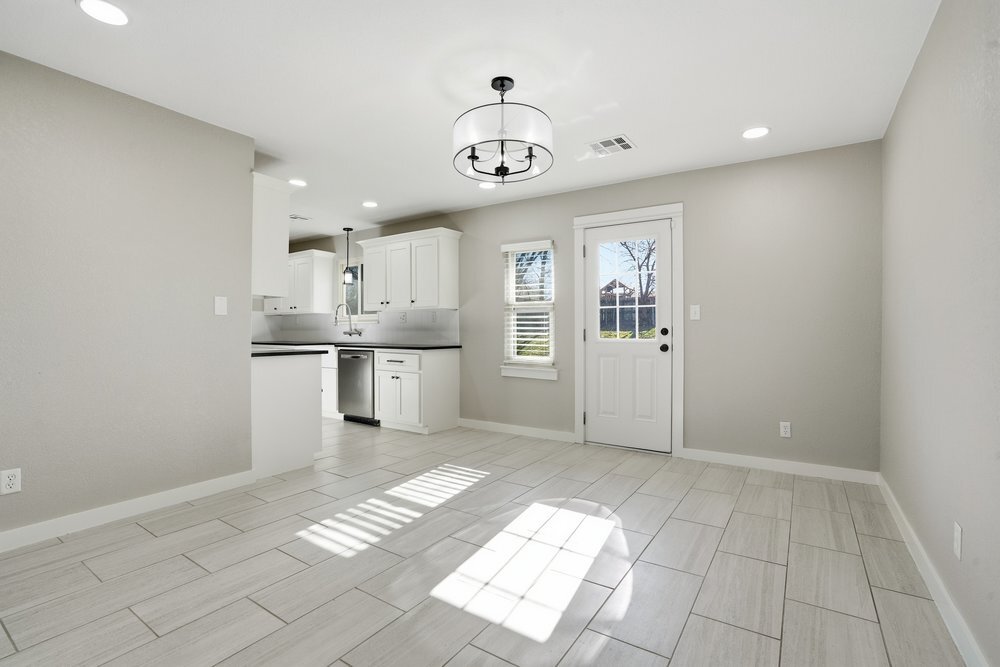 Dining Room, door to backyard, opening to kitchen on left - 14548 W 19th St S