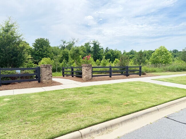 Building Photo - Beautiful Westbranch Home with 2-Car Garage, Covered Porch & Greenway Entrance Across the Street
