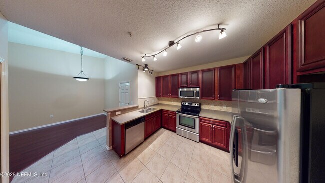 Building Photo - 8241 Pelican Landing Rd