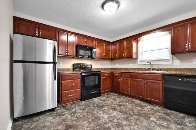 Building Photo - Pet Friendly Three Bedroom with Bonus!