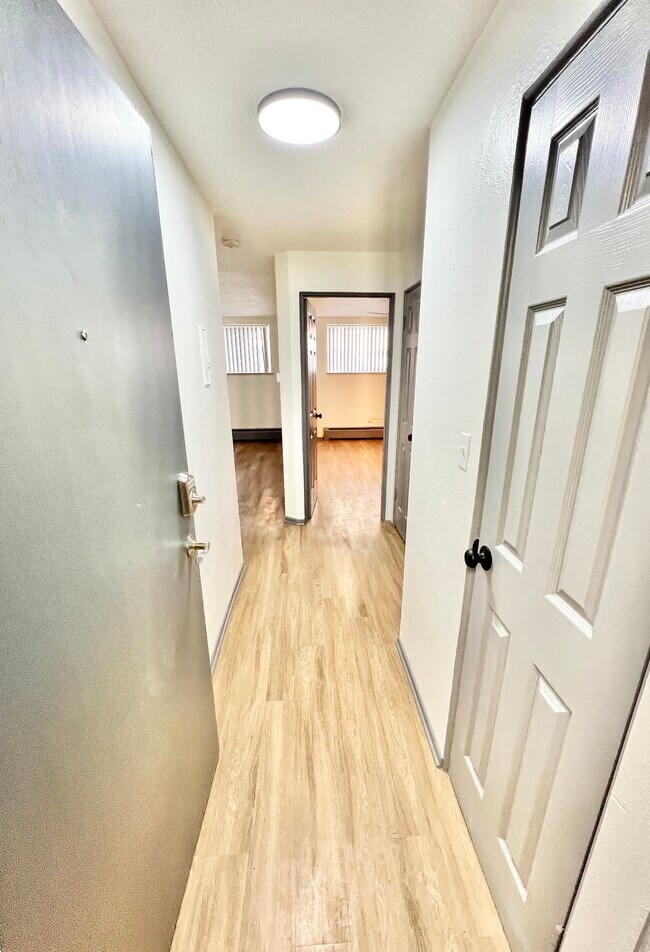 Step into a cozy and inviting apartment space. - Melody Apartments