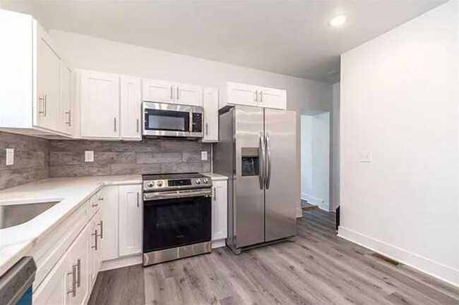 Building Photo - Brand New 4 Bedroom / 3.5 Bathroom Townhom...