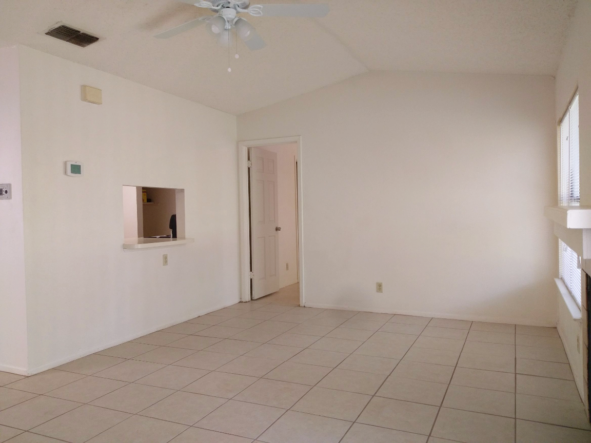 Living Room with Kitchen Pass-Through/Breakfast Bar to Master Bedroom entrance - 2527 Corian Glen Dr