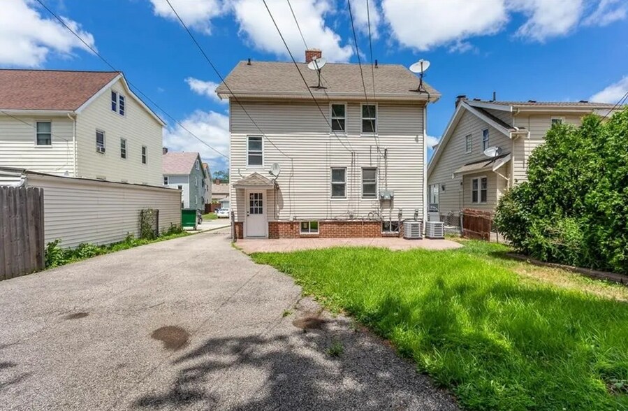 Back of home with ample parking - 14809 Leonard Ave