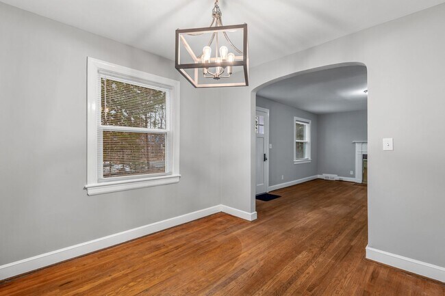 Building Photo - Brick home, Two Story, Hardwoods, DR, 2 Sun Rooms, FP, Carport!.