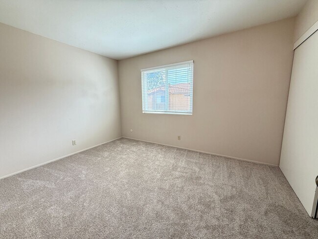 Building Photo - Move in Ready! 2BD Townhome! New Carpet! Two Patio Spaces! Attached Garage!