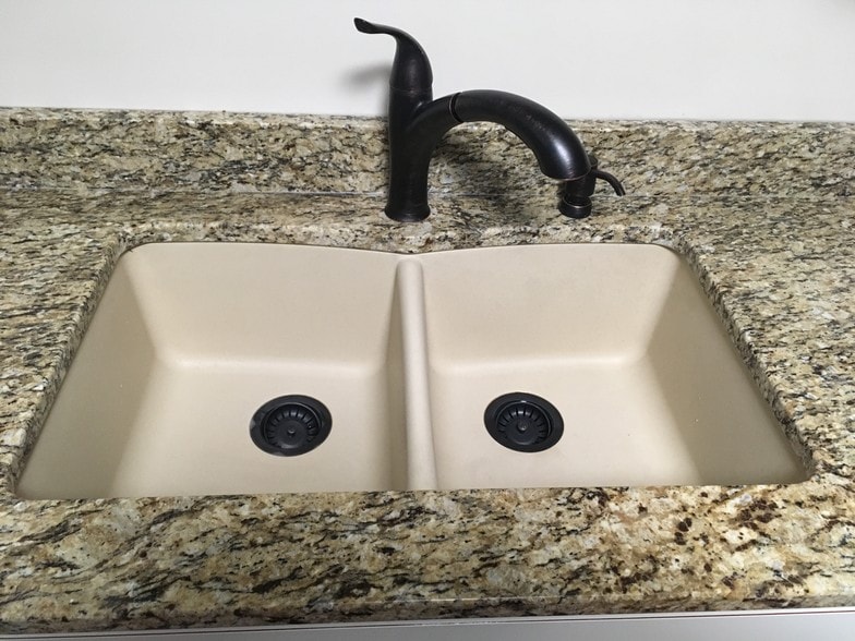 Kitchen sink with spray nozzle faucet - 1851 Broadway St