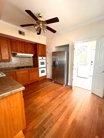 Kitchen (picture is of downstairs unit, but identical layout) - 2900 Palmer Ave