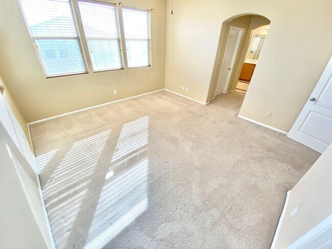 Building Photo - THIS SPACIOUS RESIDENCE FEATURES 4 BEDROOM...