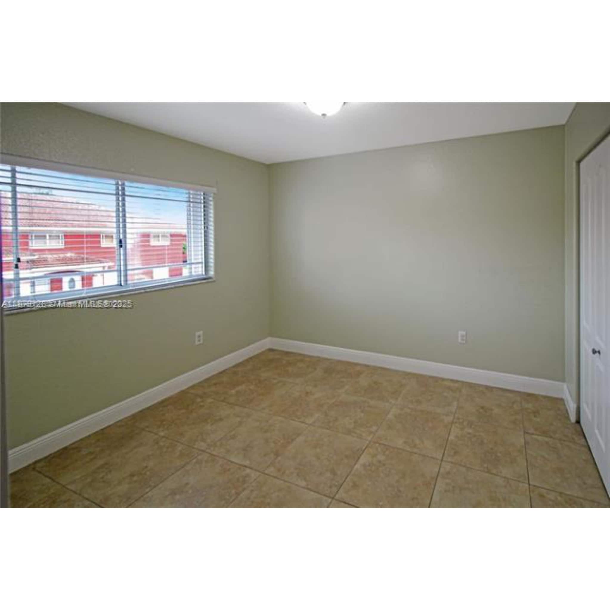 Building Photo - 10953 W Okeechobee Rd