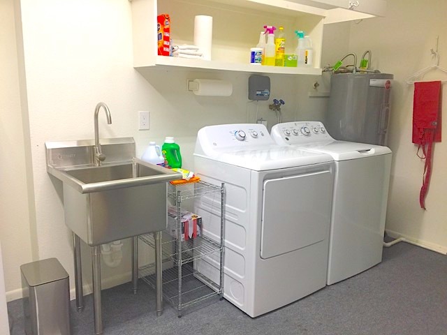 New washer, dryer, utility sink and water heater. - 12414 W Nugget Ct