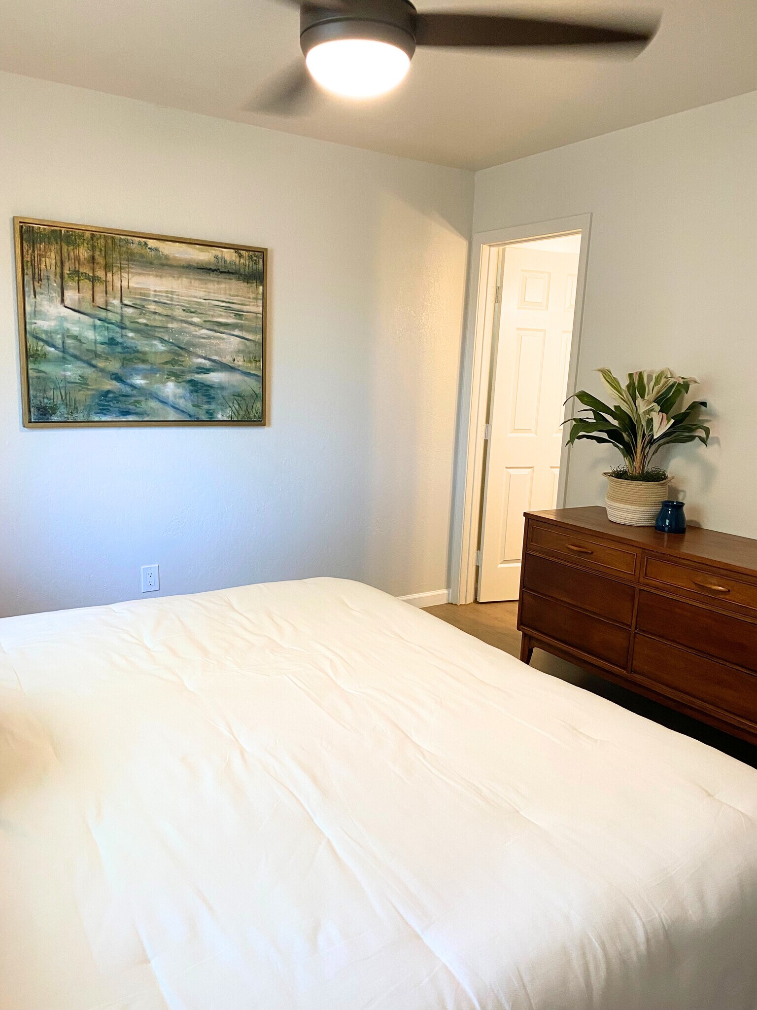 Spacious Master Bedroom with a stylish dresser & a private ensuite bathroom for your convenience. - 1795 W 28th St