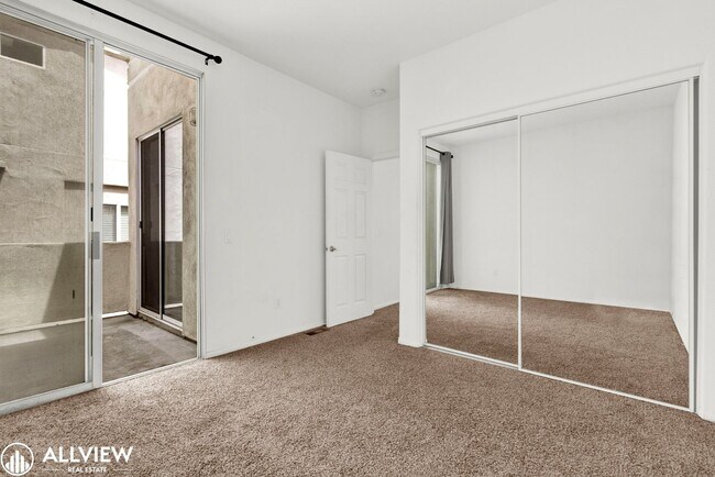 Building Photo - Spacious Coastal Condo with Rooftop Ocean ...