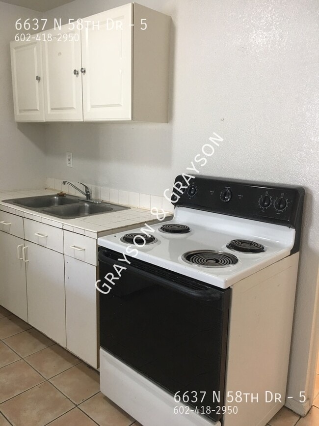 Building Photo - 6637 N 58th Dr