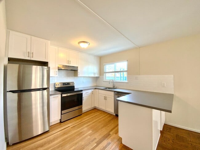 Building Photo - REMODELED KITCHEN! Storage, Parking Available, On-Site Laundry!