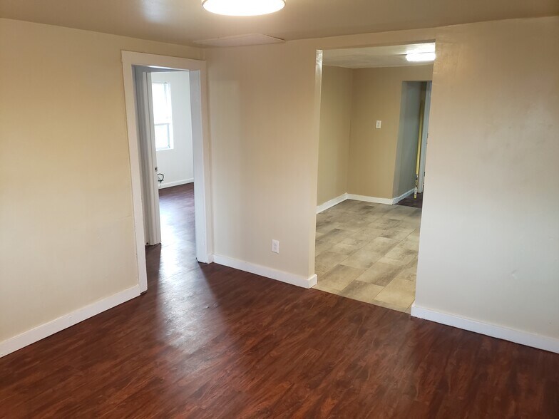 Living room facing bedroom #2 (left) and kitchen (right) - 43 Lissner Ave