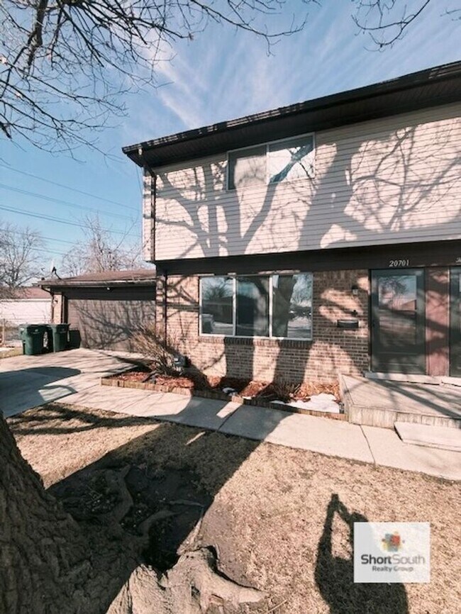 Building Photo - Updated - 2 bed 1.5 bath, Duplex with attached garage and fenced in backyard