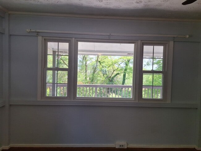 Building Photo - Cute white cottage with white picket fence & Huge deck off back door!