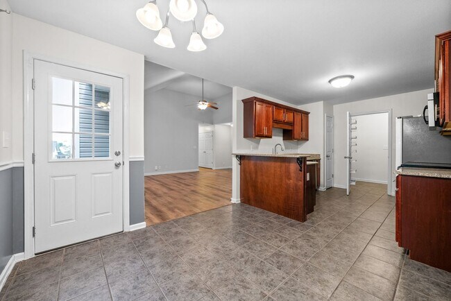Building Photo - Pet Friendly Three Bedroom with Bonus!