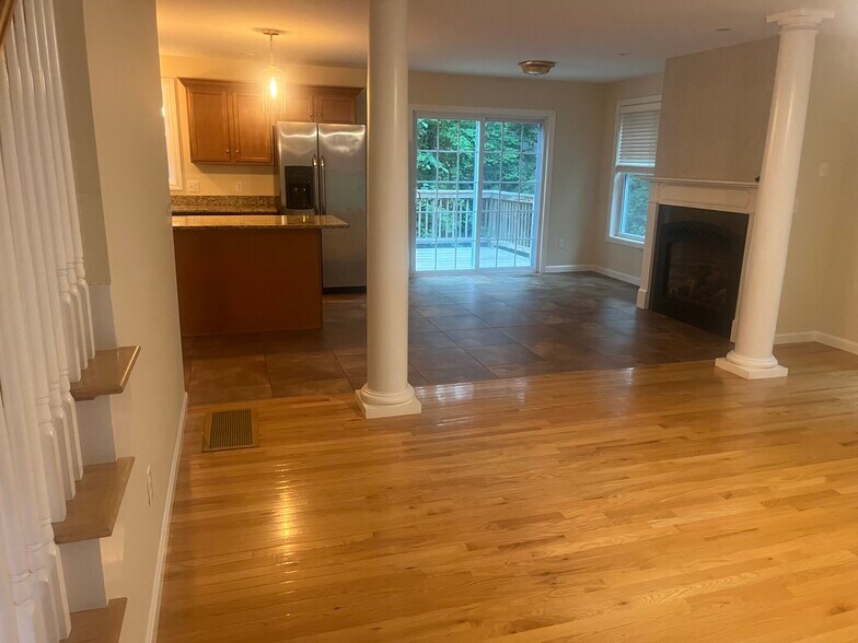 open to the living room, and fireplace and porch - 11 Pinecrest Dr