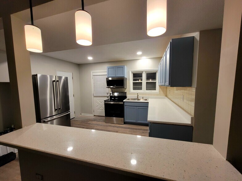 View of kitchen from bar - 465 W Main St