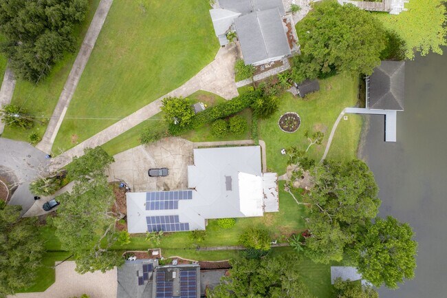 Building Photo - Lake Jessamine Luxury: Solar-Powered Waterfront Retreat on 1.14 Acres with Dock & Boathouse