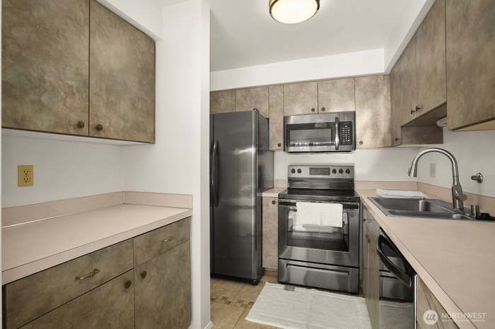 Kitchen both updated appliances, refrigerator, dishwasher, microwave and cooktop range - 9030 Seward Park Ave S