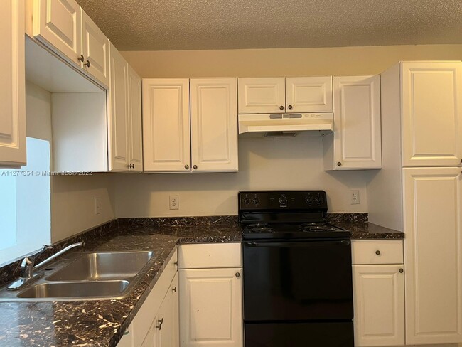 Building Photo - 7355 Woodmont Terrace