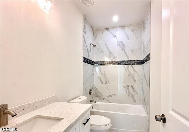 Building Photo - 2404 Dickens Ave N