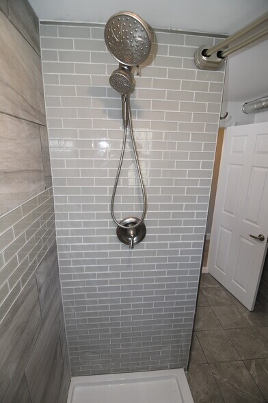 Glass Tile wall in shower. - 309 Old York Rd