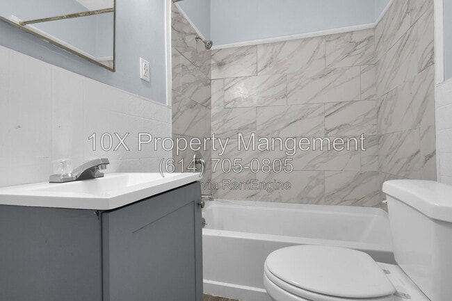 Building Photo - 1311 E 24th Ave