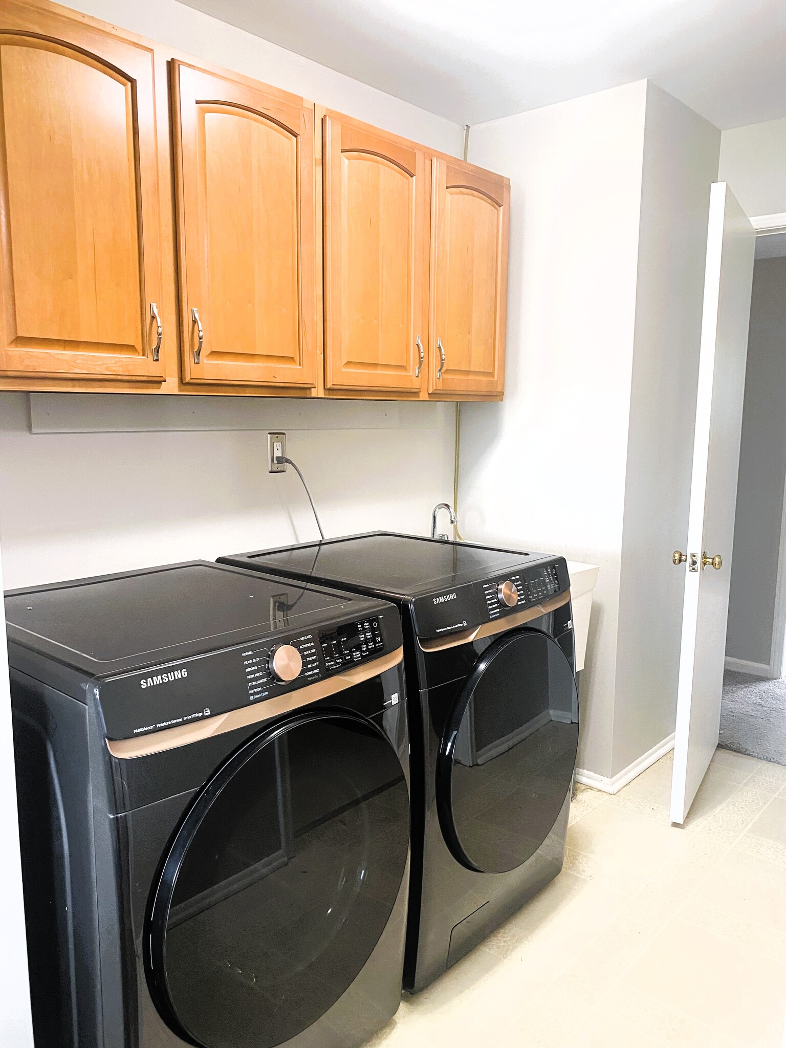 Open laundry area with storage. - 1611 Ludean Dr
