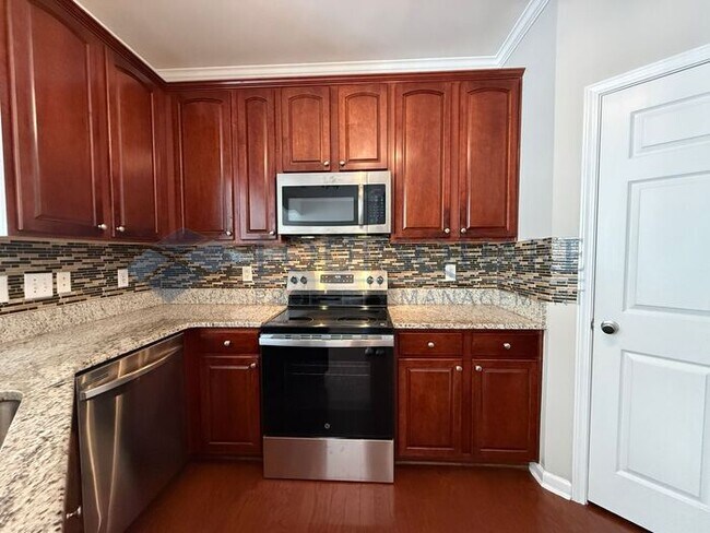 Building Photo - Lovely 3-Bedroom Townhome with Fireplace, Back Patio  & Community Amenities Included! Convenient ...