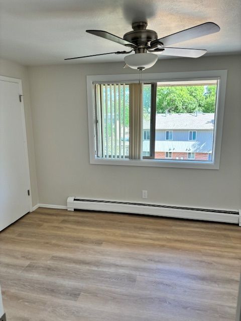 Experience the comfort of this bright and airy bedroom, perfect for relaxation. - 591 West Prentice Avenue