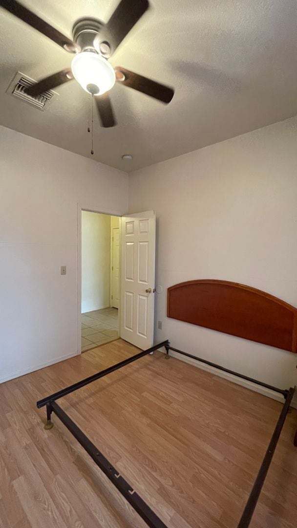 Building Photo - Modern town home with AC. 3/2. Covered, off-street parking, easy care yard.  Ample kitchen. Lamin...