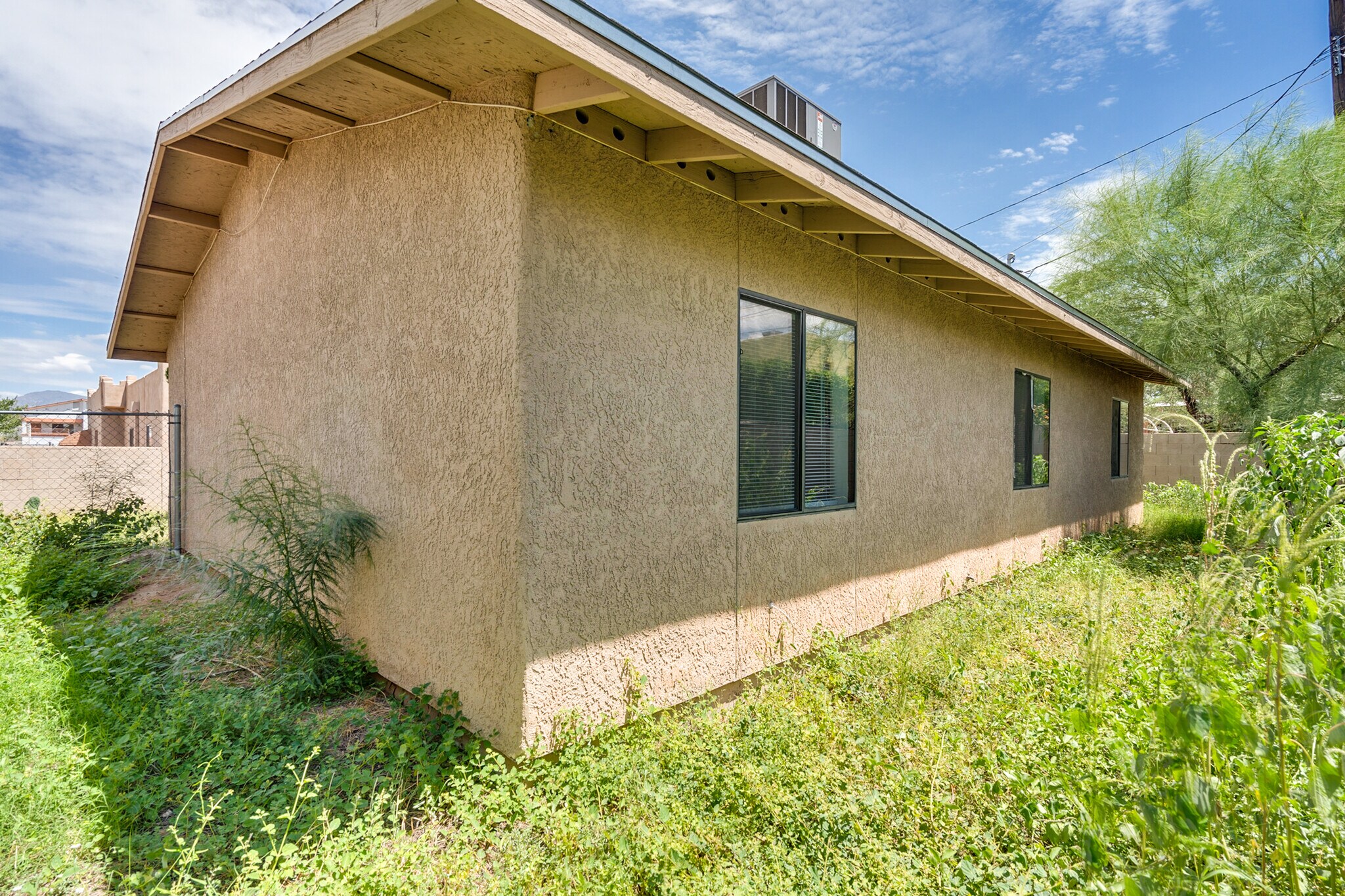 Backyard. Each bedroom includes a window that overlooks the backyard - 3138 E Adams St