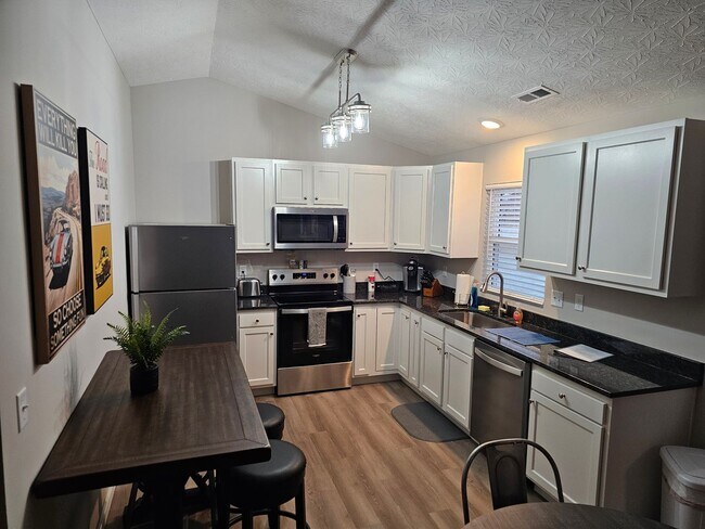 Building Photo - Vroooom . . . . the ROAD is calling. . . .Fully furnished themed rental includes all utilities an...