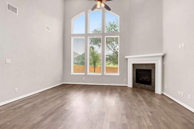 Building Photo - ASK ABOUT FREE APPLICATIONS THROUGH AUGUST!  "Spacious 4-Bedroom Sanctuary with Cozy Fireplace in...