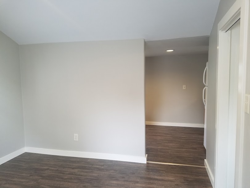 Living room looking into kitchen - 103 12th W St