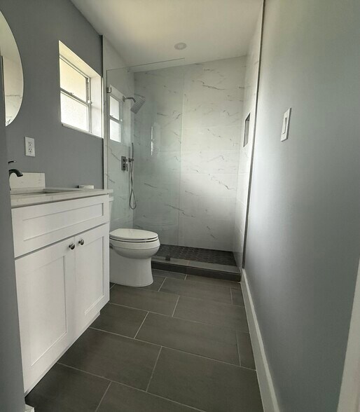 New bathroom with shower and lots of storage - 1404 NW 6th Ave