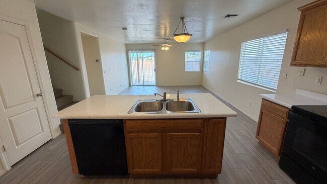 Building Photo - Two Story Home with NEW tile and a large backyard!