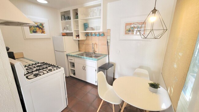 Building Photo - Charming, Fully Furnished Spanish-Style Du...