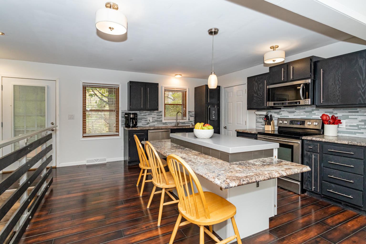 Updated kitchen with center island and stainless steel appliances - 5428 Norris St