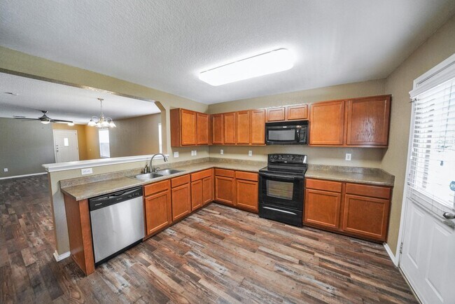 Building Photo - Energy-Smart Single-Story Now Available in...