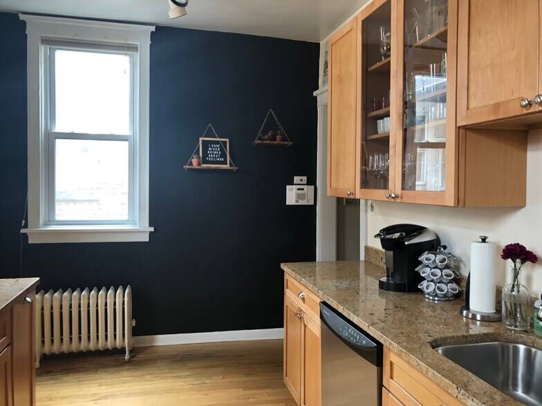 Kitchen with dishwasher, 42 inch maple cabinets, stainless steel appliances, and granite countertops - 3654 N Janssen Ave