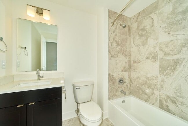 Building Photo - Sweet 2 Bed 2 Full Bath Downtown Indy Condo with Balcony Views!