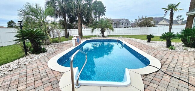 Building Photo - “Elegant 5-Bed Executive Home with Pool – ...