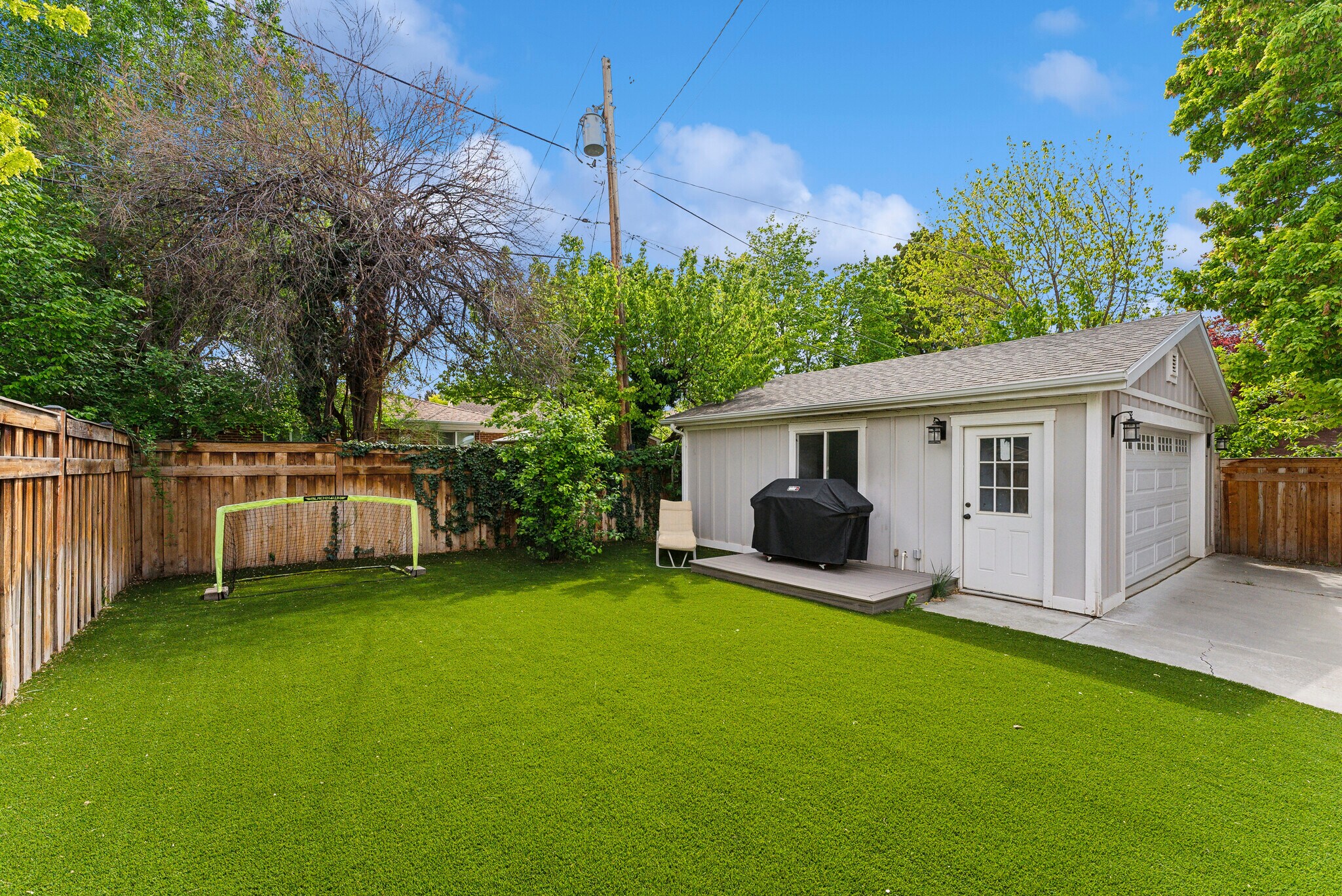 enclosed yard with no maintenance faux grass - 1044 E Wood Ave